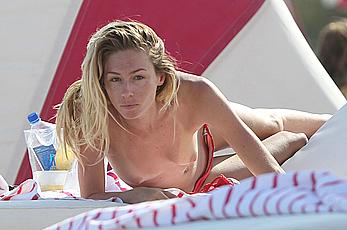 Brianna Addolorato sunbathing topless on a beach in Miami