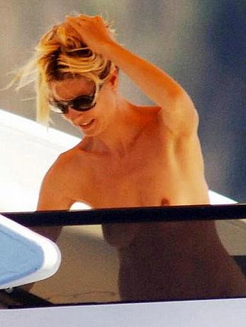 Heidi Klum caught topless on a balcony