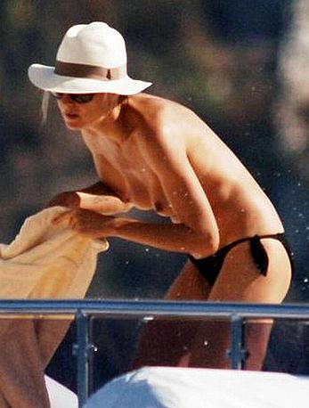 Heidi Klum caught topless on a balcony