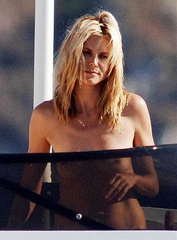 Heidi Klum caught topless on a balcony