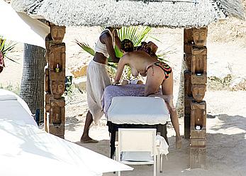 Lisa Snowdon on the beach in Ibiza boob peek