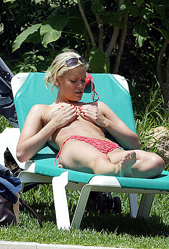 Suzanne Shaw sunbathing topless