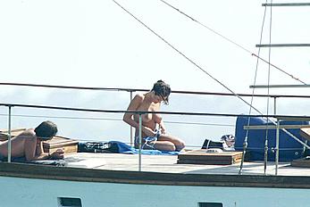 Manuela Arcuri sunbathing topless on a yacht