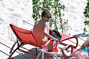 Elizabeth Hurley topless on a beach paparazzi shots