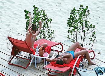 Elizabeth Hurley topless on a beach paparazzi shots