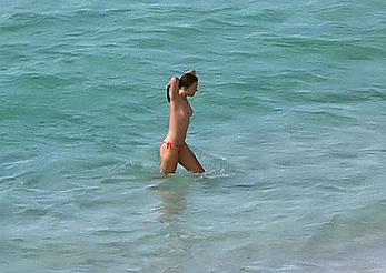 Elizabeth Hurley topless on a beach paparazzi shots