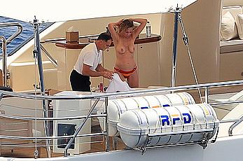 Melanie Griffith topless goes for a massage aboard a Yatch in Ibiza