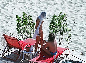 Elizabeth Hurley topless on a beach paparazzi shots