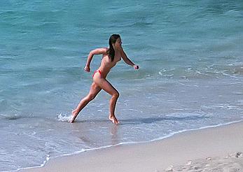 Elizabeth Hurley topless on a beach paparazzi shots