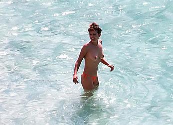 Elizabeth Hurley topless on a beach paparazzi shots