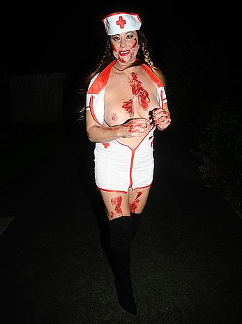 Lisa Appleton flashes her nude boobs in bloody nurse-costume at Halloween Party