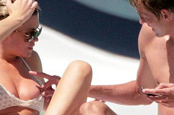 Abigail Clancy caught topless on a yacht