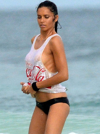 Adriana Lima in a see through wet top behind the scene of a photoshoot in Cancun