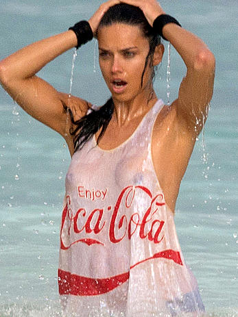 Adriana Lima in a see through wet top behind the scene of a photoshoot in Cancun