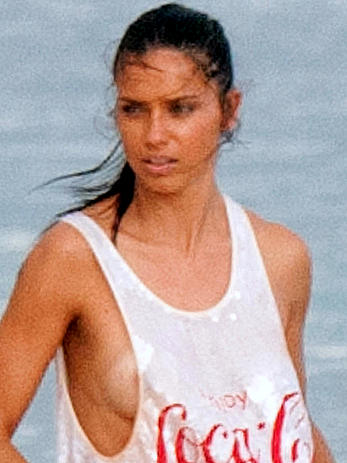 Adriana Lima in a see through wet top behind the scene of a photoshoot in Cancun