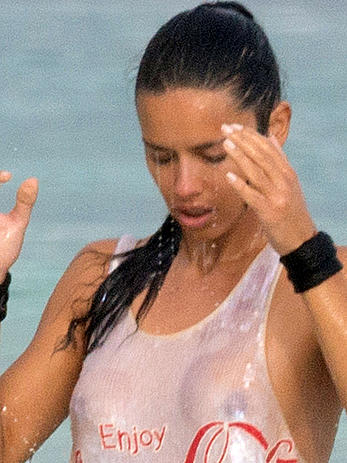 Adriana Lima in a see through wet top behind the scene of a photoshoot in Cancun