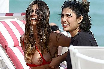 Aida Domenech changing on a beach shows her nude breasts