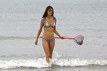 Supermodel Alessandra Ambrosio in bikini on a beach in Brazil