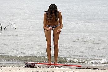 Supermodel Alessandra Ambrosio in bikini on a beach in Brazil