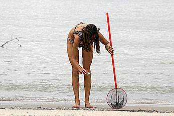 Supermodel Alessandra Ambrosio in bikini on a beach in Brazil