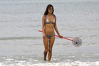 Supermodel Alessandra Ambrosio in bikini on a beach in Brazil