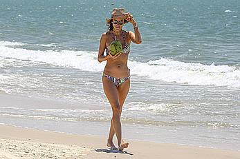 Alessandra Ambrosio sips on coconut at the beach in Brazil