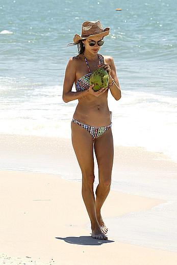 Alessandra Ambrosio sips on coconut at the beach in Brazil