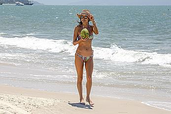 Alessandra Ambrosio sips on coconut at the beach in Brazil