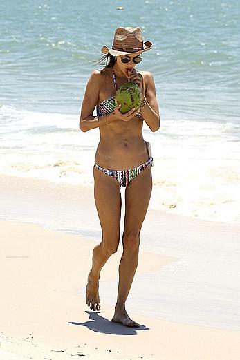 Alessandra Ambrosio sips on coconut at the beach in Brazil