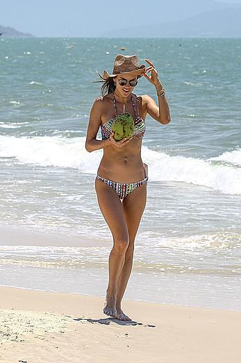 Alessandra Ambrosio sips on coconut at the beach in Brazil