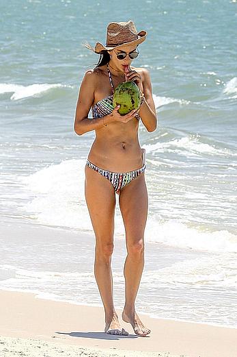 Alessandra Ambrosio sips on coconut at the beach in Brazil