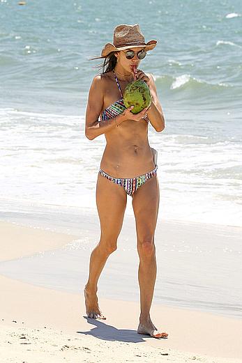 Alessandra Ambrosio sips on coconut at the beach in Brazil