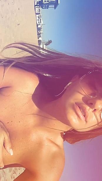 Alexandra Stan topless enjoys a sunny day on the beach