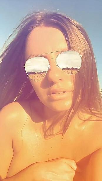 Alexandra Stan topless enjoys a sunny day on the beach