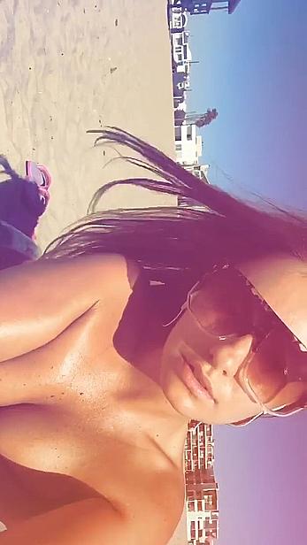 Alexandra Stan topless enjoys a sunny day on the beach