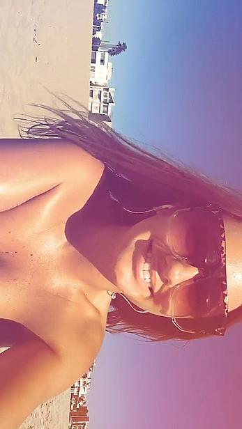 Alexandra Stan topless enjoys a sunny day on the beach