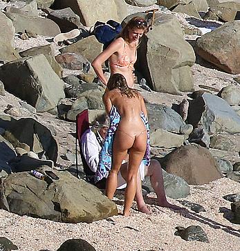 Alexis Ren topless on a beach in St.Barth's