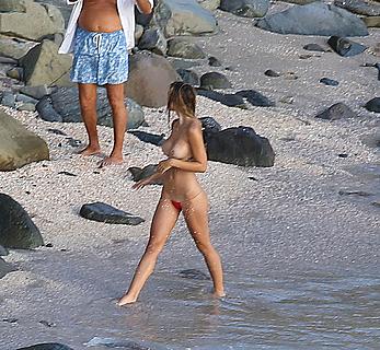 Alexis Ren topless on a beach in St.Barth's