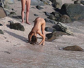 Alexis Ren topless on a beach in St.Barth's