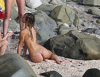 Alexis Ren topless on a beach in St.Barth's