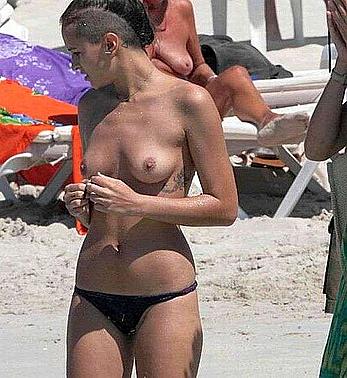 Alice Dellal topless on the beach paparazzi shots