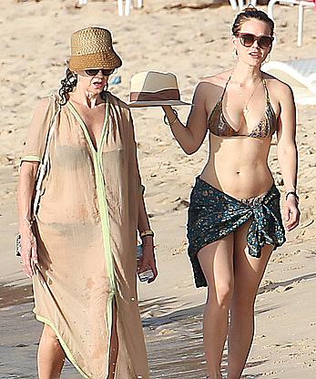 Alice Eve wearing a bikini at a beach in Barbados