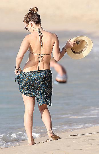 Alice Eve wearing a bikini at a beach in Barbados