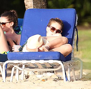 Alice Eve wearing a bikini at a beach in Barbados