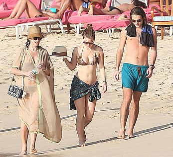 Alice Eve wearing a bikini at a beach in Barbados