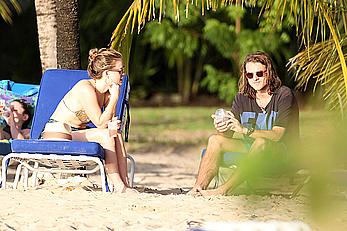 Alice Eve wearing a bikini at a beach in Barbados