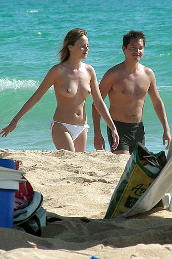 Alicia Bogo caught topless on a beach