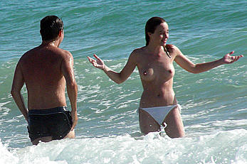 Alicia Bogo caught topless on a beach