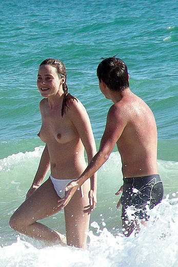 Alicia Bogo caught topless on a beach