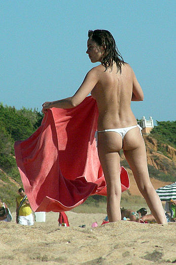 Alicia Bogo caught topless on a beach